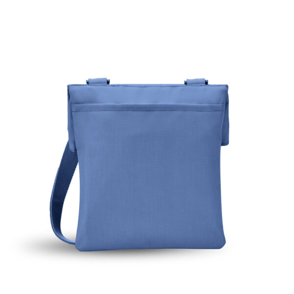The sustainably-made Sherpani Pica crossbody bag is shown here in Pacific Blue, which is a color-blocked black and blue bag. The back of the bag is all blue with an exterior slip pocket.