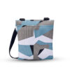 The back of the eco-friendly Sherpani Pica crossbody bag shown with a geometric Summer Camo print in black, blue, and white.
