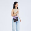 The earth-friendly Sherpani Pica crossbody bag, shown here in Lavender and brown colorblock with turquoise zipper pulls, is sustainably-made and has 5 pockets for all your gear.