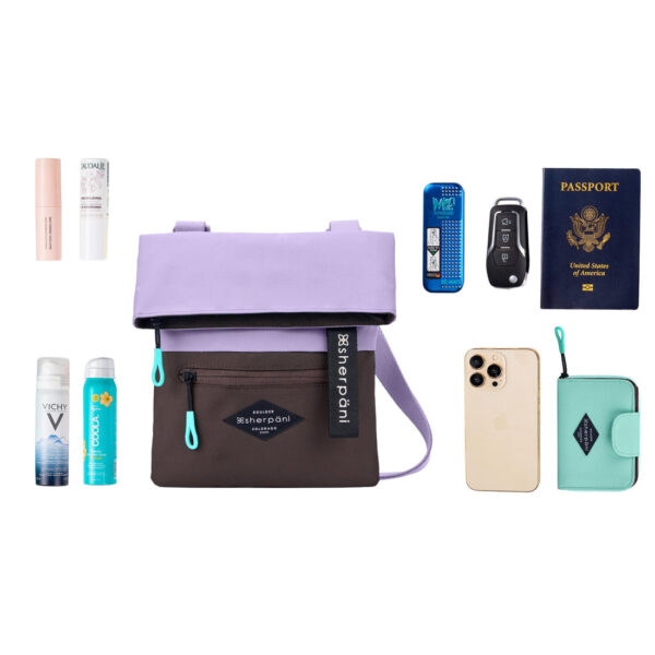 The earth-friendly Sherpani Pica crossbody bag, shown here in Lavender and brown colorblock, is sustainably-made and has 5 pockets for all your gear.