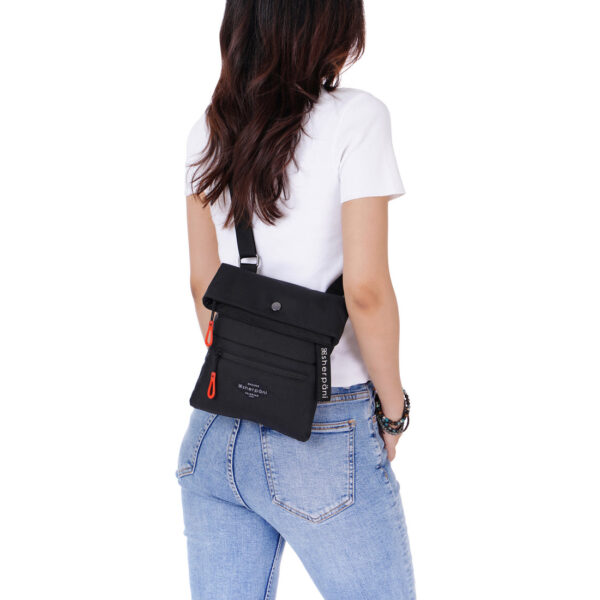 The earth-friendly Sherpani Pica crossbody bag, shown here in Raven black with bright red zipper pulls, is sustainably-made and has 5 pockets for all your gear. It can be worn on the shoulder or as a crossbody bag.