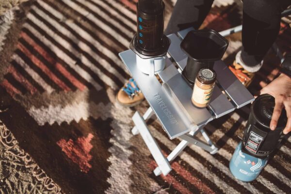 Overhead view of drinks on foldable Canyon aluminum outdoor side table