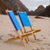 Set of eco-friendly, USA-made wood portable chairs in blue on beach