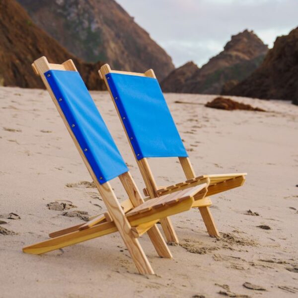 Set of eco-friendly, USA-made wood portable chairs in blue on beach