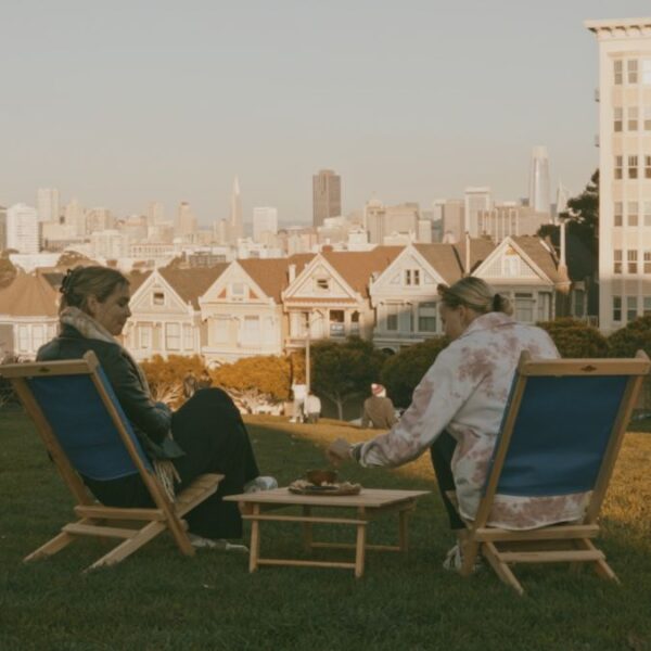 Women in park picnic with sustainable, portable wood furniture set