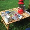 Outdoor, wood foldable travel table with camping items