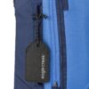 Black recycled luggage tag on suitcase for sustainable travel