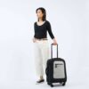 The earth-friendly Latitude rolling luggage by Sherpani is carry-on friendly and made with recycled materials. Shown here standing on 4 sturdy wheels in sterling gray.