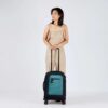 The Latitude rolling luggage by Sherpani is carry-on friendly and made with recycled materials. Shown here with 4 sturdy wheels and extendable handle in teal.
