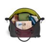 The eco-friendly Trip rolling duffel bag, shown here in merlot and black, is made of recycled fabrics. The interior is lime green and has ample space for all of your clothes and accessories.