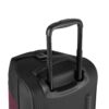 The Trip rolling duffel bag, shown here in merlot and black, is made of recycled fabrics. The hardware, including extending handle, is durable and made to last.