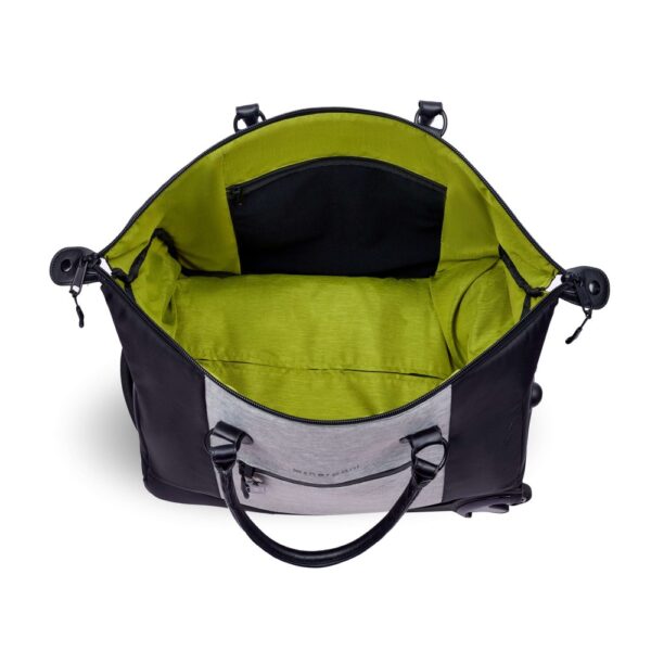 The Trip rolling duffel bag, shown here in sterling gray and black, has a lime green liner. The bag is made of recycled fabrics and can be carried as a duffel or a roller bag.