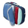 Side view of travel clothes in dual pocket packing cube made from recycled materials