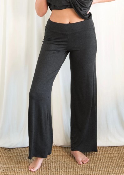 Model is wearing eco-friendly power pants in charcoal by JJWINKS. This is a carbon neutral product made in the USA.