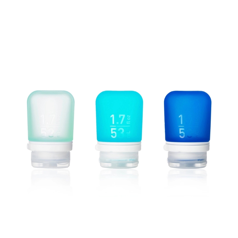 Set of 3 silicone squeeze bottles with lockable caps in 3 shades of ocean blue colors. 1.7 oz size shown here.