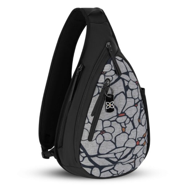 The Esprit AT Shoulder Sling bag is seen here in Sakura pattern. It has a black back with a gray and black flowery-looking patterned front.