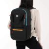 This is the Sherpani Camden Convertible Backpack in the chromatic color. It's been worn as a backpack in this picture. This bag is made from recycled material.