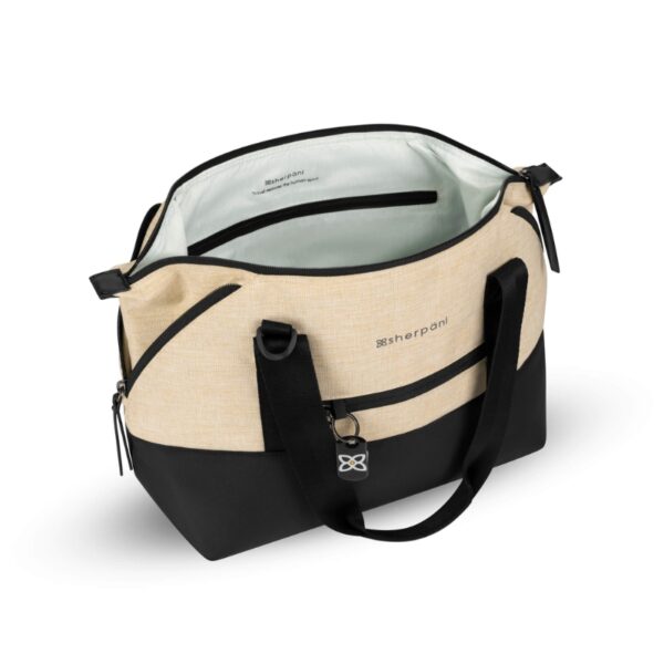 This shows the Sherpani Eclipse Convertible Travel Bag in the straw color. The top half is straw while the bottom half is black. This image shows the top unzipped so you can see inside.