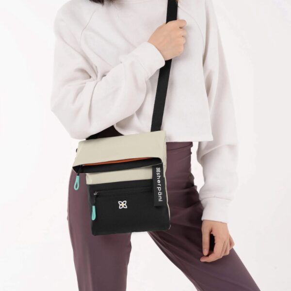 This is the Sherpani Pica Mini Crossbody bag in the bluff color. It's made from 100% recycled material.