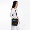 This shows the Sadie crossbody bag in Chromatic worn over someone's shoulder like a purse.