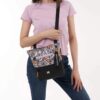 Here's somebody wearing the Sadie Crossbody bag - utilizing that crossbody strap and keeping the bag close to their hip.